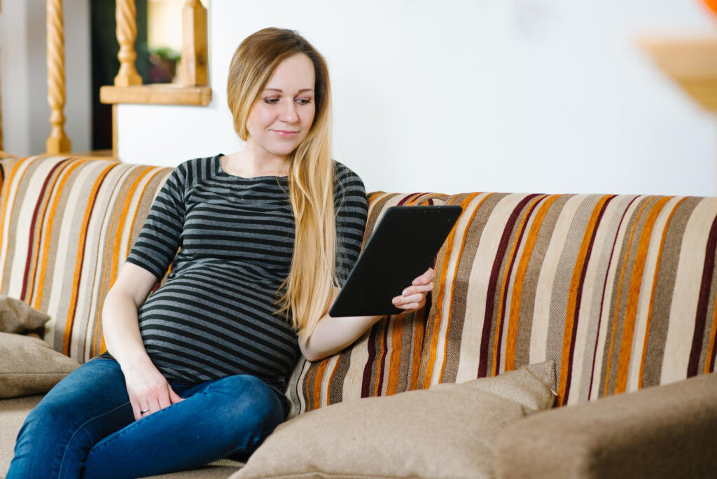 Pregnant Woman looking at options for midwife care